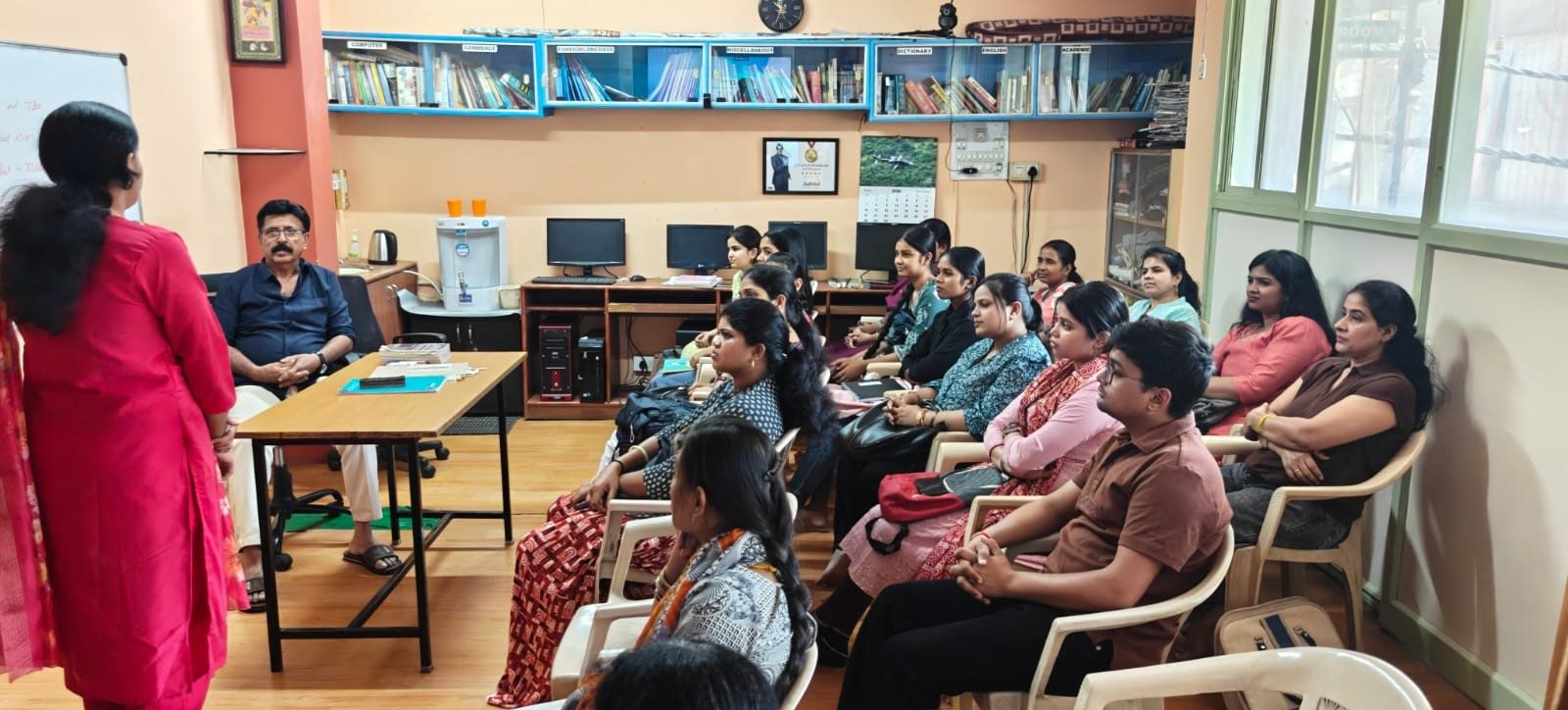 Trainer addressing a classroom of learners at Nile