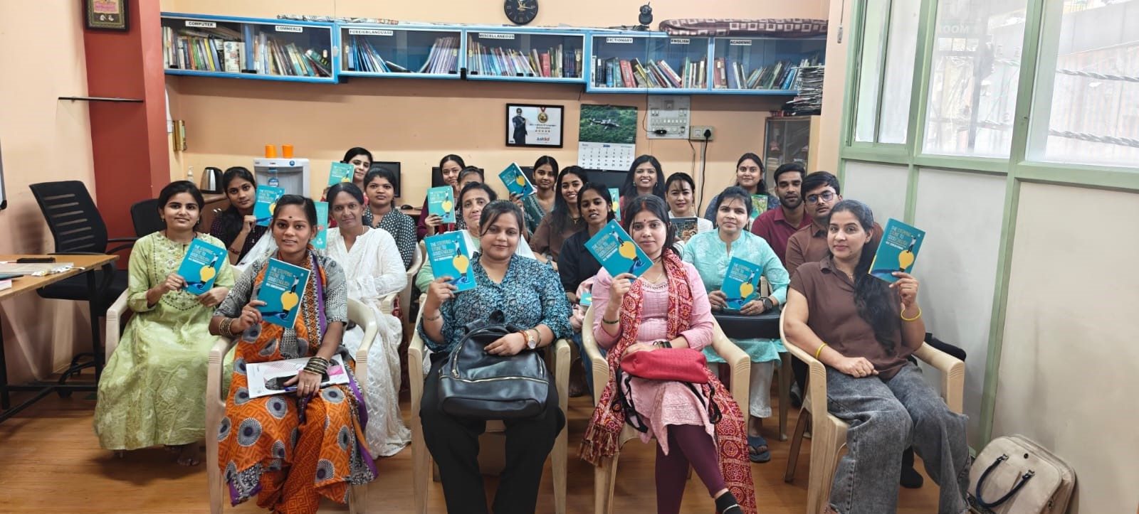 Group of students holding their course books at Nile Institute, Bangalore