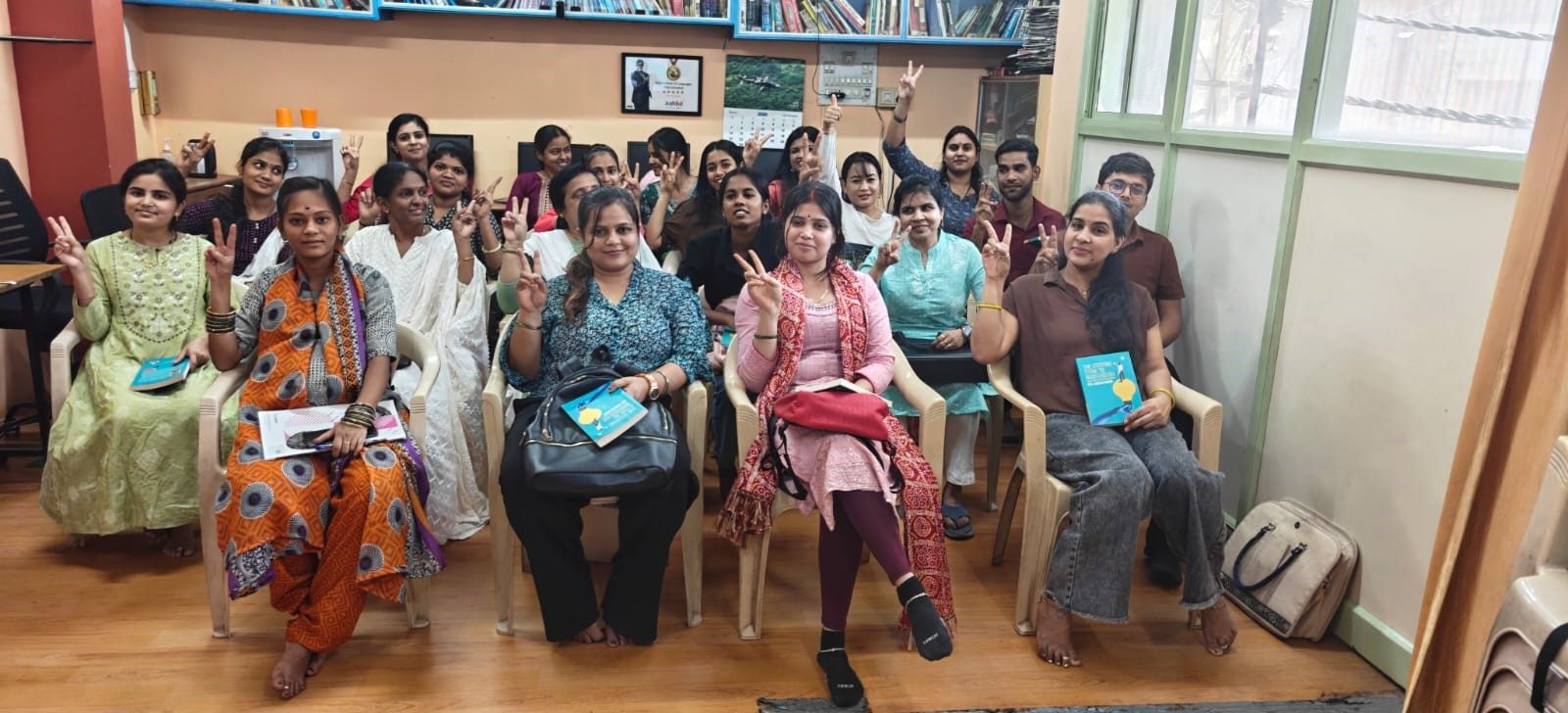 Cheerful group of students with their course books at Nile