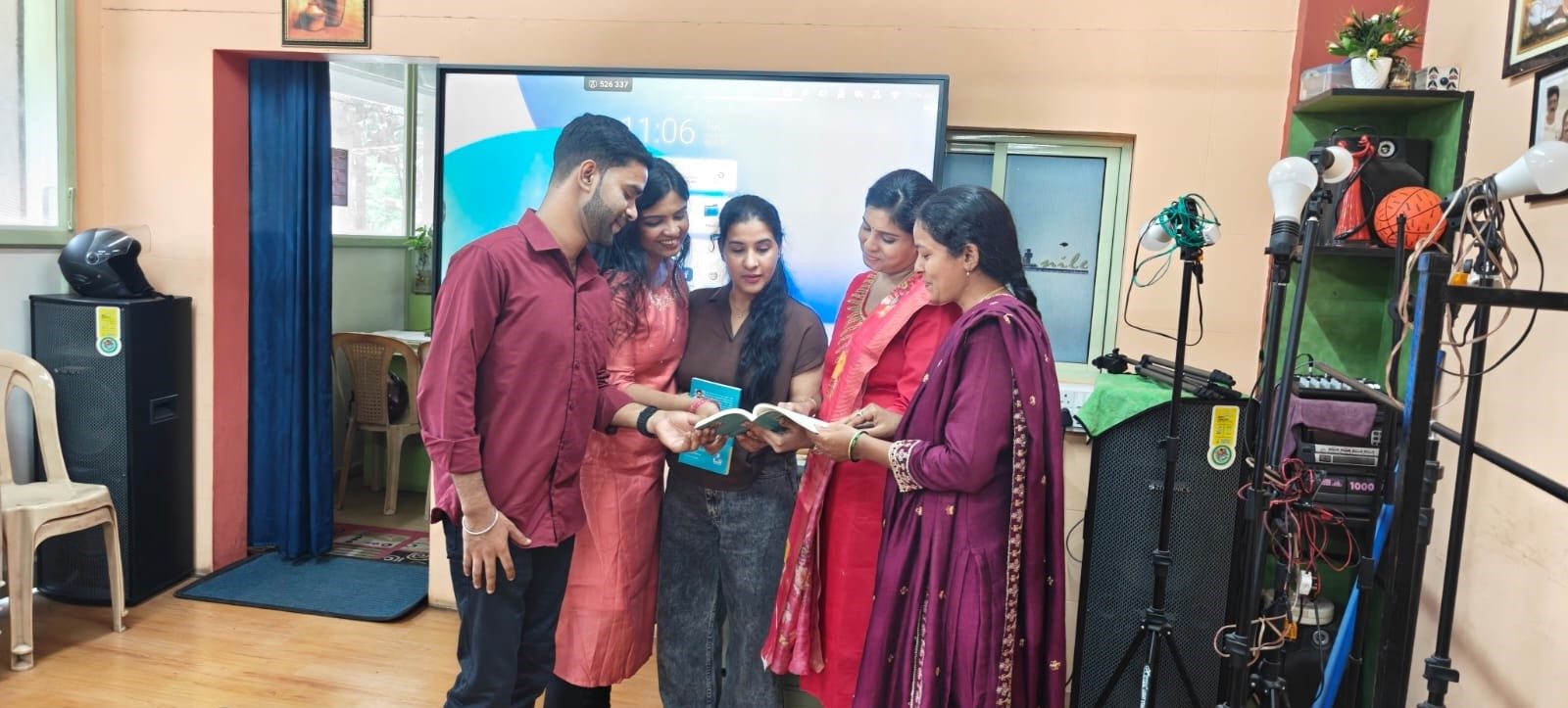 Students browsing a course book at Nile Institute