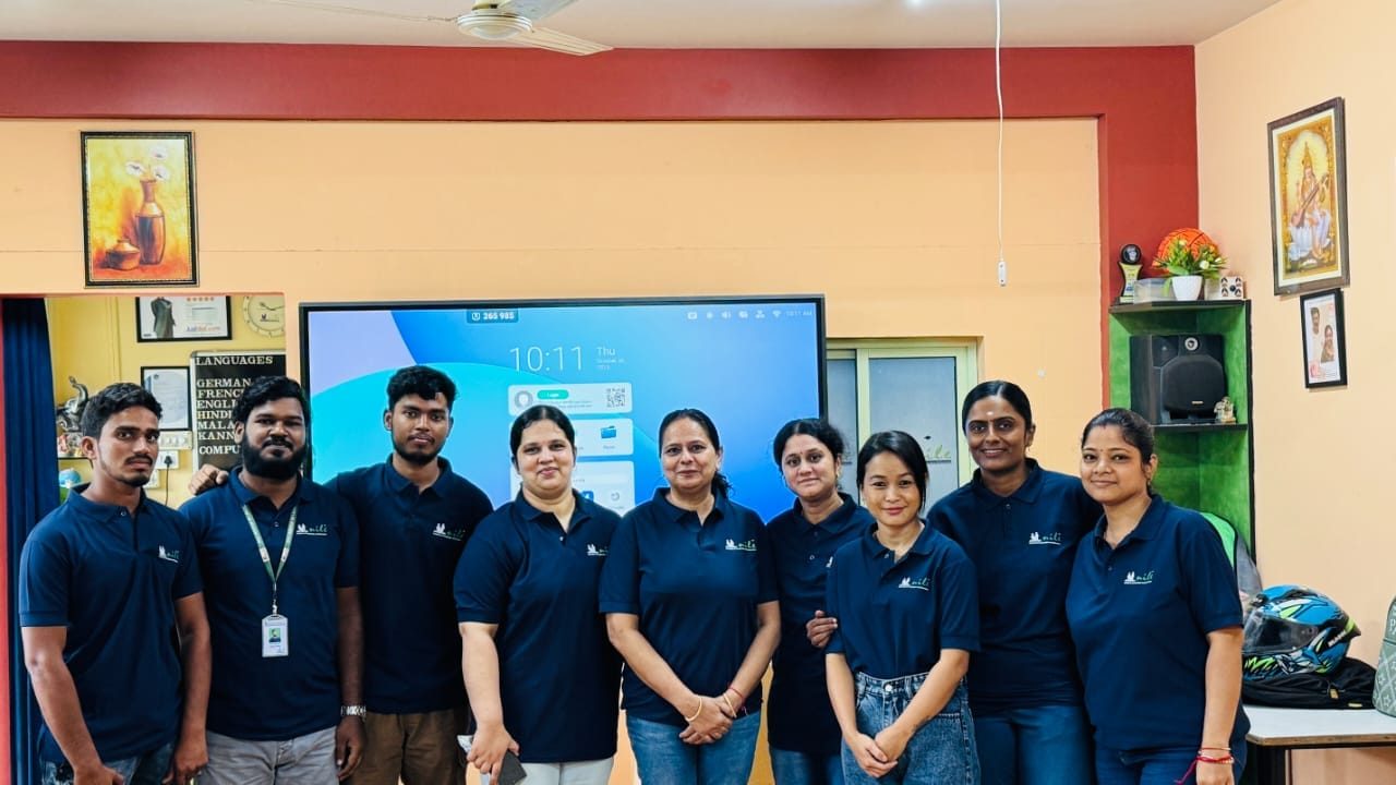 The Nile team standing together in the classroom