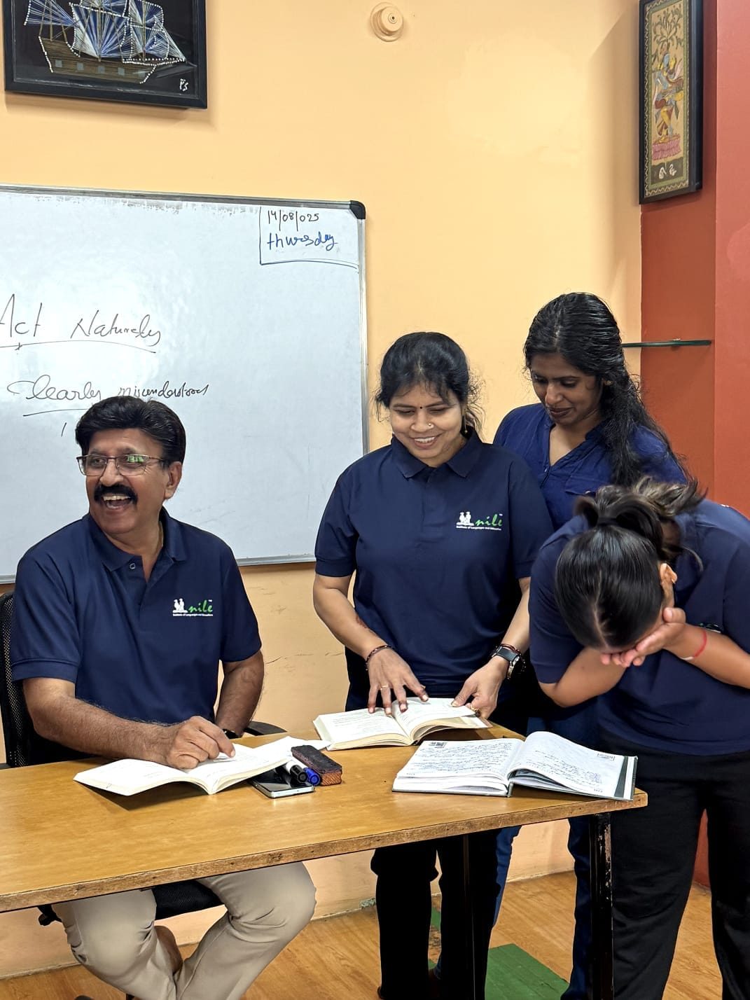Nile trainers reading a text together with a colleague