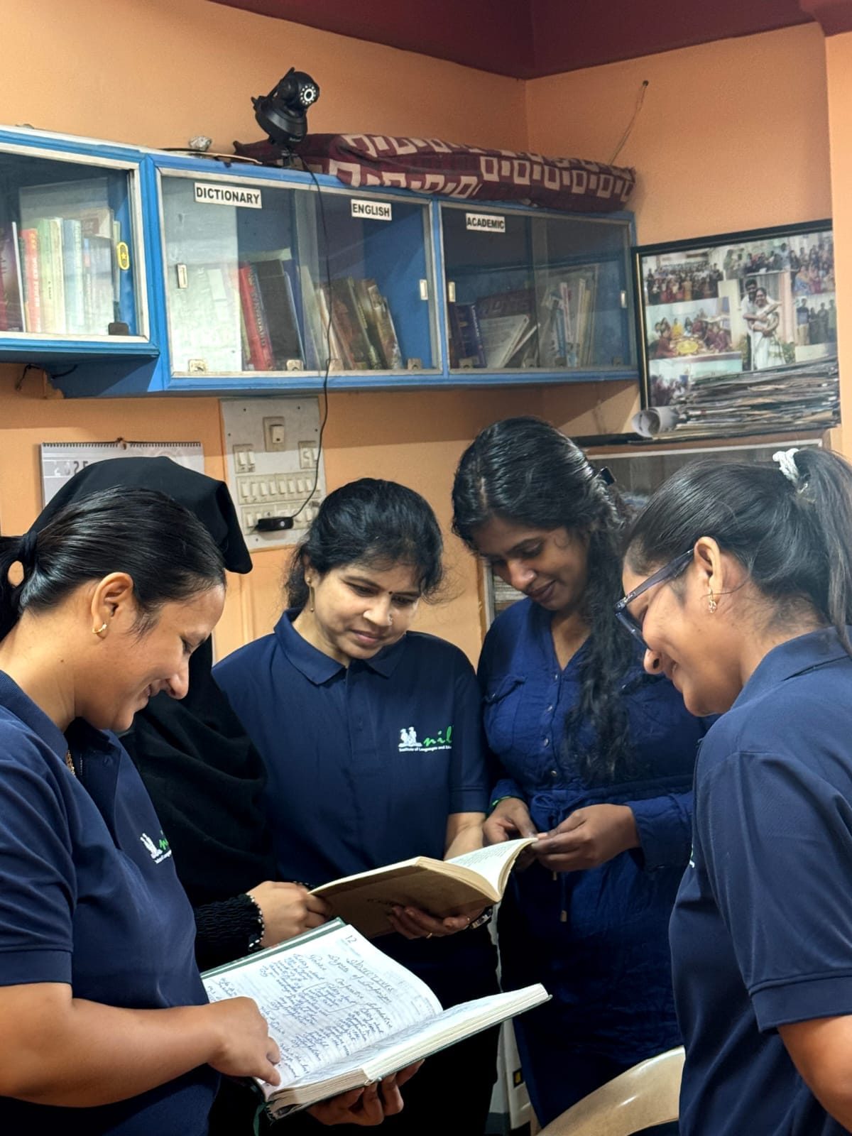 Nile team members studying a book together